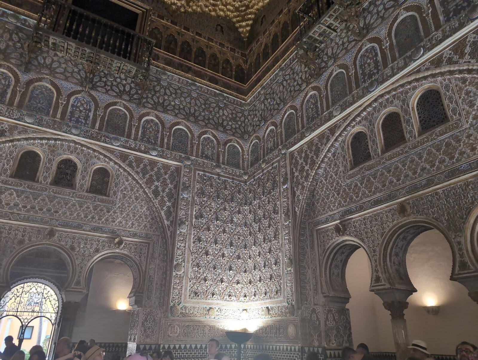 Intricately decorated walls and arches inside the Alcázar