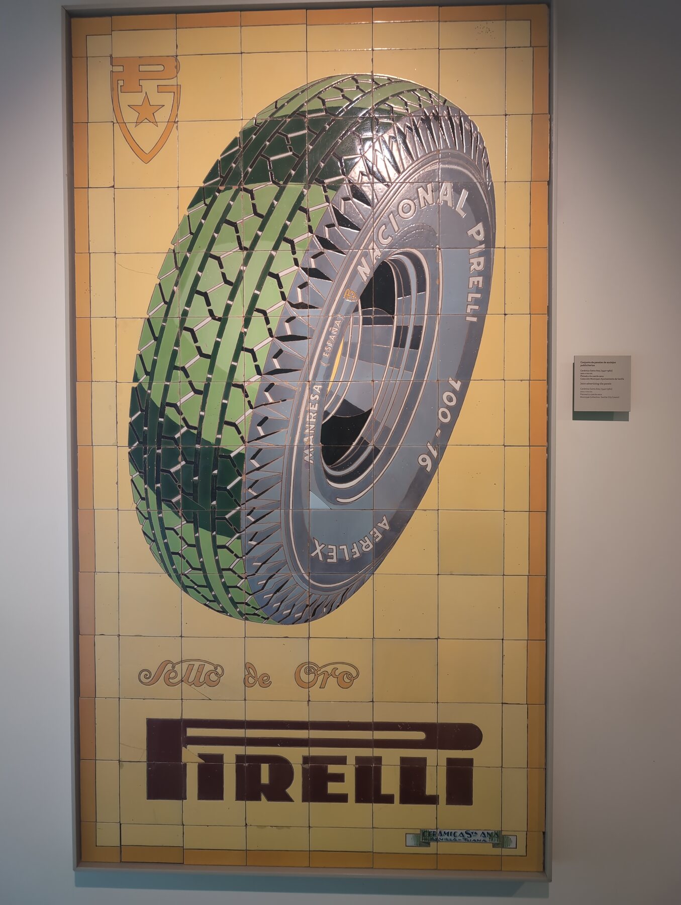 A yellow and green Pirelli tire advertisement made from ceramic tiles