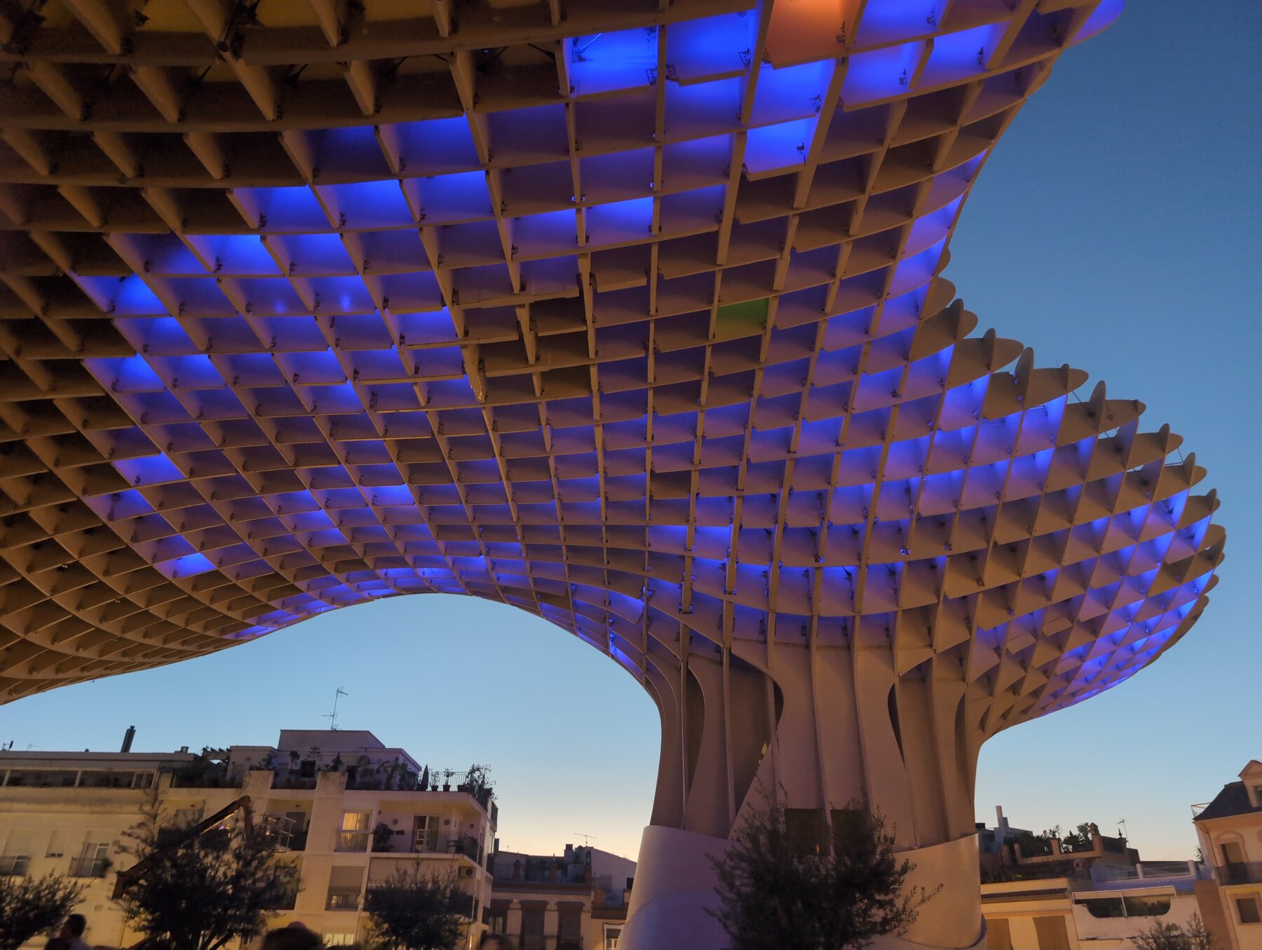 Blue lights illuminating the Setas de Sevilla after sunset